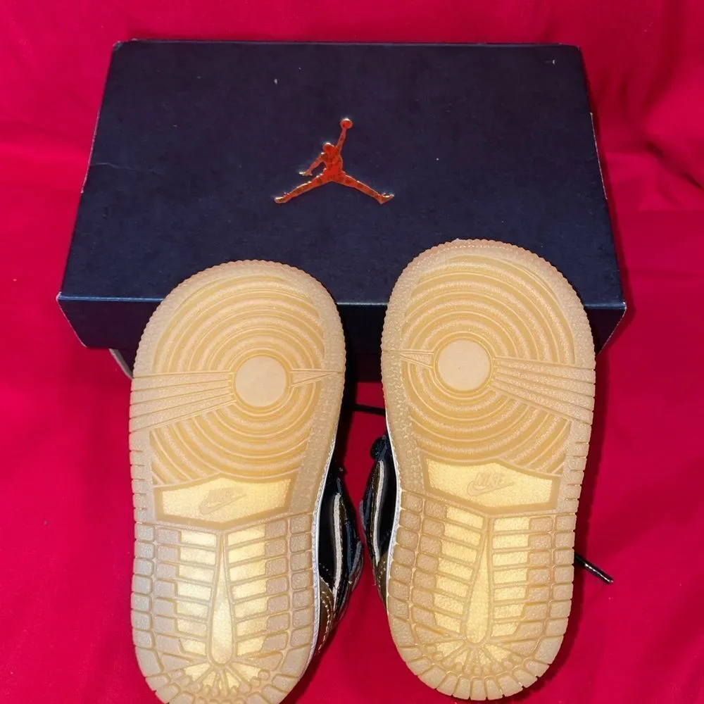 Jordan 1 Retro High Top Nike Black and Gold Sneakers